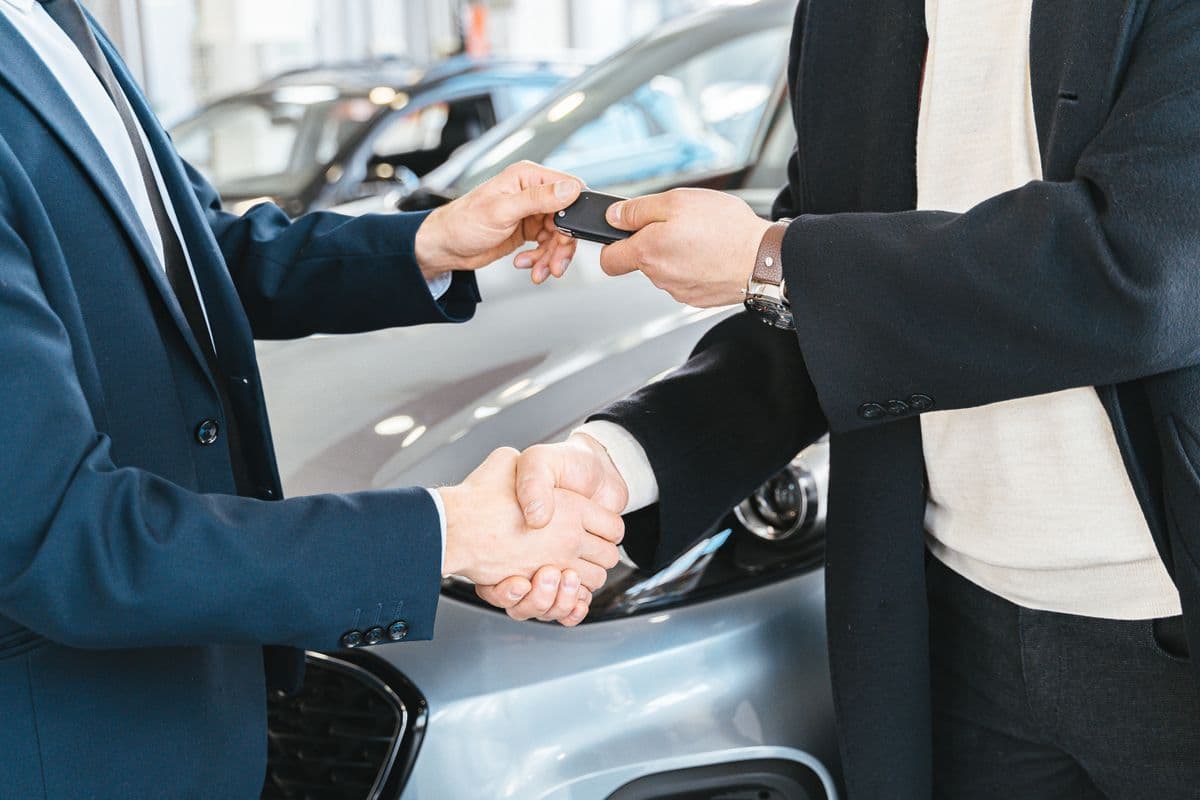 Handing over car keys to a happy customer